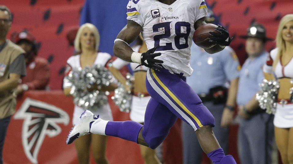 Minnesota Vikings running back Adrian Peterson runs the ball