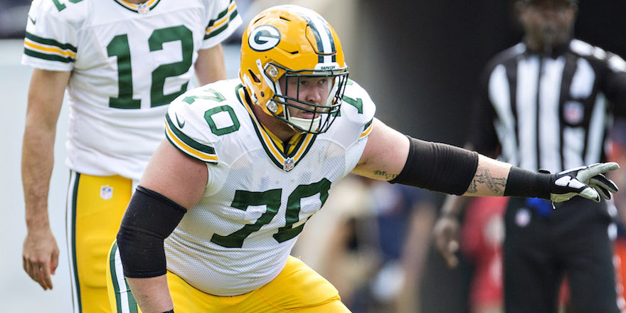 CHICAGO, IL - SEPTEMBER 13: T.J. Lang #70 of the Green Bay Packers prepares to block during a game against the Chicago Bears at Soldier Field on September 13, 2015 in Chicago, Illinois. The Packers defeated the Bears 31-23. (Photo by Wesley Hitt/Getty Images)