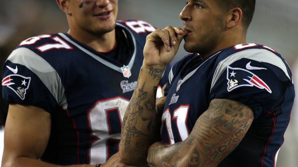 Tight end Aaron Hernandez (81) of the New England Patriots avoids