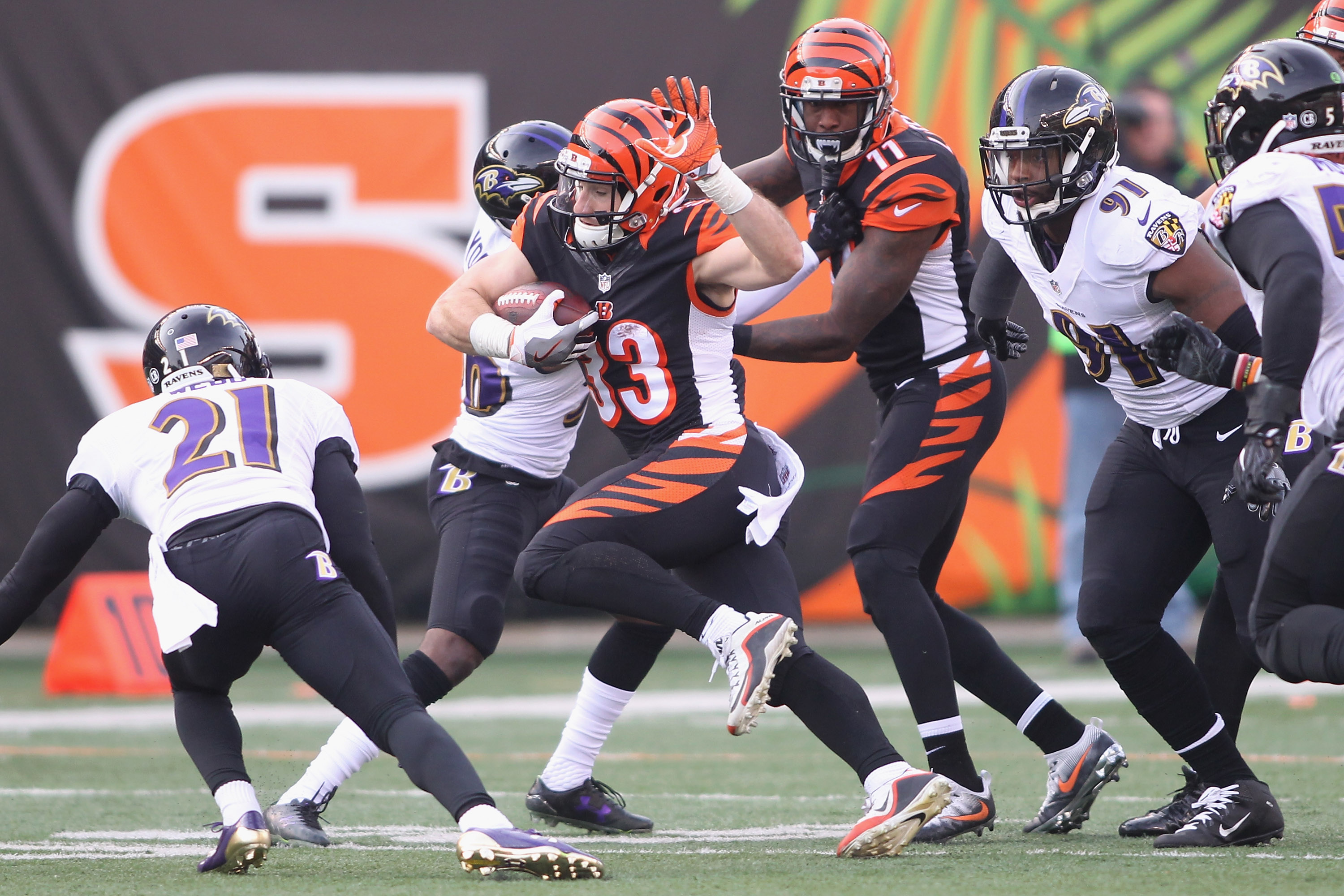 CINCINNATI, OH - JANUARY 01:  Rex Burkhead #33 of the Cincinnati Bengals runs the football upfield against Lardarius Webb…