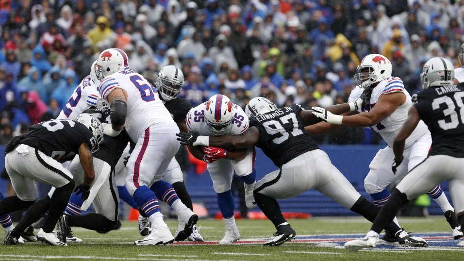 Oakland Raiders defensive players, including Mario Edwards (97