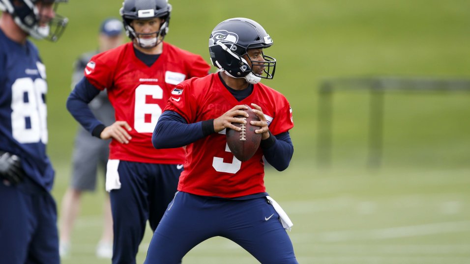 Russell Wilson of the Seattle Seahawks looks to pass against the San