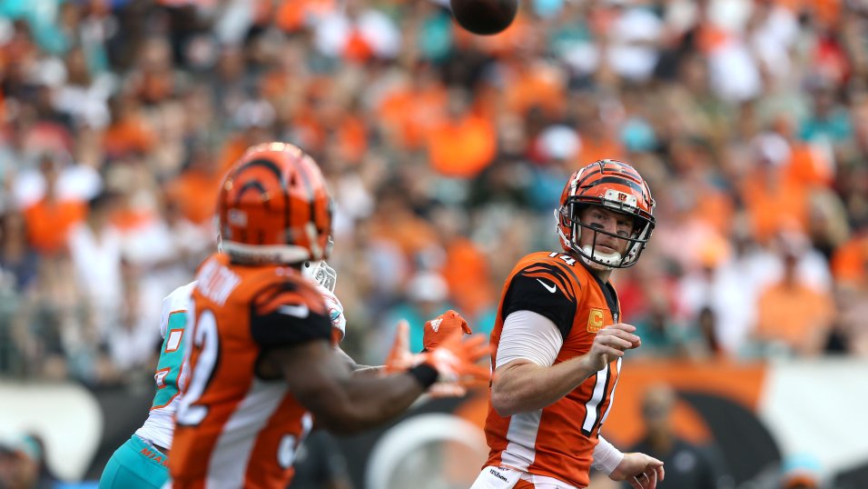 Andy Dalton of the Cincinnati Bengals attempts to break a tackle