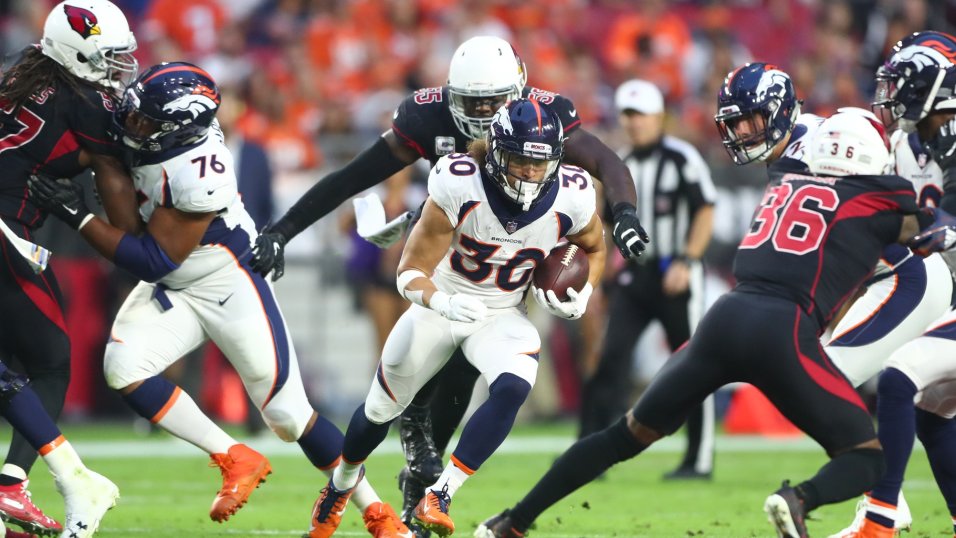 Phillip Lindsay enjoying the spotlight running behind one of the NFL’s