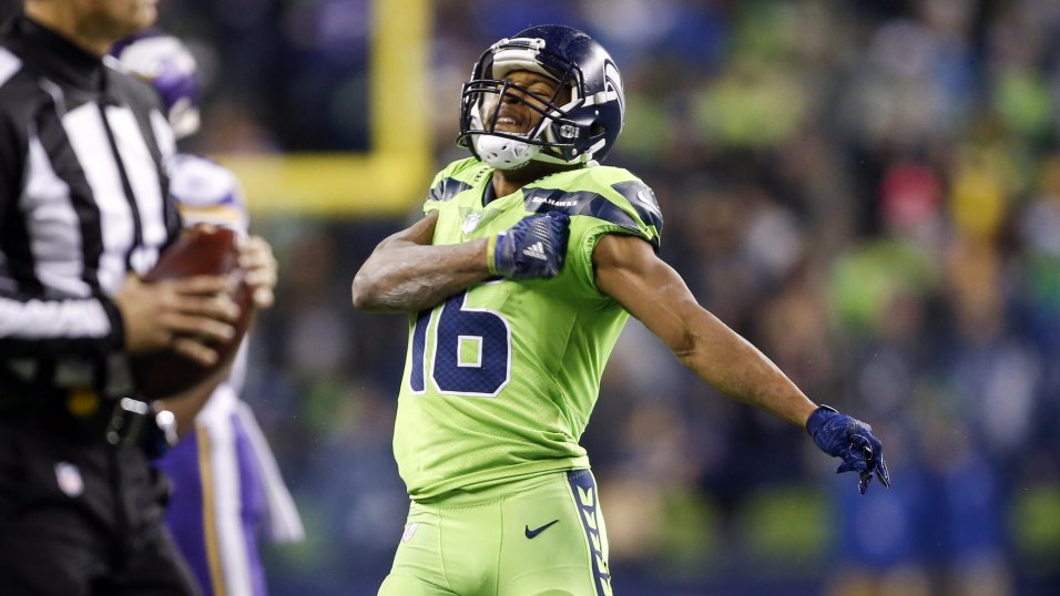 Seattle Seahawks wide receiver Tyler Lockett (16) runs the ball