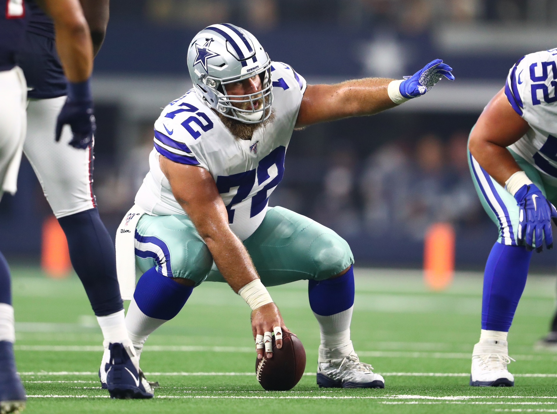 Dallas Cowboys' and Denver Broncos' kickers and other special-teams  players warm up prior to a National Football League game at the Cowboys'  home field AT&T Stadium in Arlington, Texas