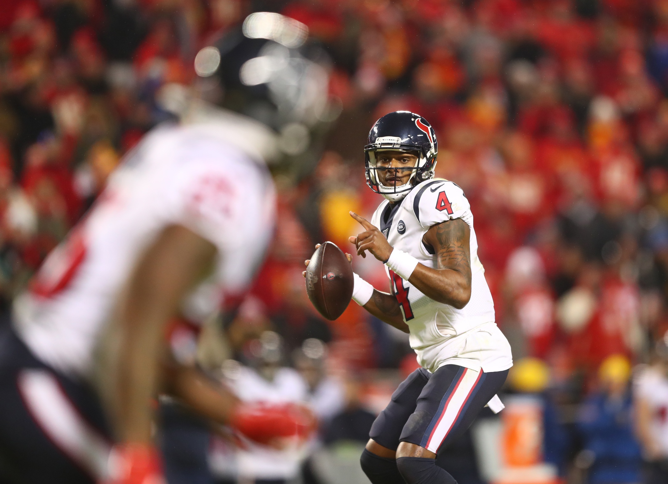 Kansas City, United States. 12th Jan, 2020. Houston Texans quarterback  Deshaun Watson (4) attempts to get away from Kansas City Chiefs strong  safety Tyrann Mathieu (32) during the AFC Divisional Playoff game