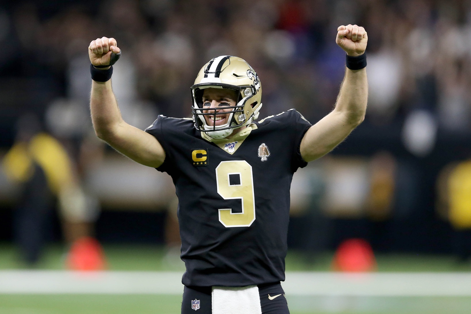 New Orleans Saints quarterback Drew Brees (9) drops back looking for an  open teammate during the first quarter of an NFL football game between the Miami  Dolphins and the New Orleans Saints