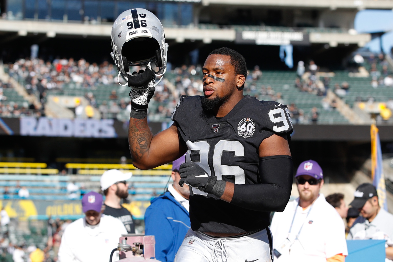 Las Vegas Raiders defensive tackle Maliek Collins (97) stretches