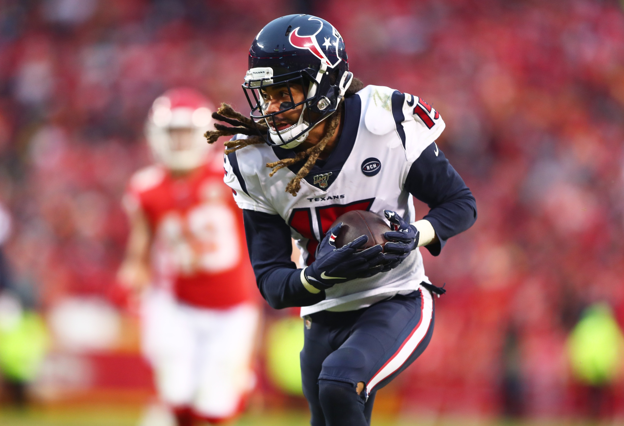 Cleveland Browns DESHAUN WATSON (4) escapes Houston Texans defenders during  the game between the Cleveland Browns and the Houston Texans in Houston,  Texas at NRG Stadium on December 4, 2022. The Cleveland