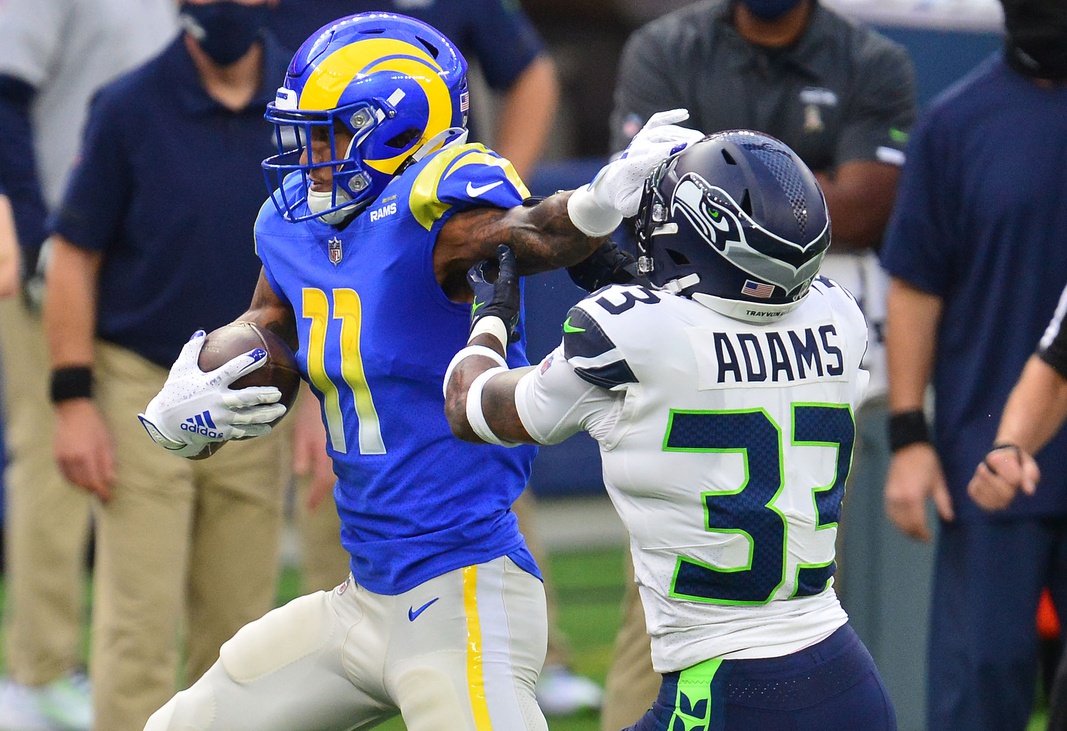 Washington Redskins wide receiver Terry McLaurin (17) makes a catch and is  pulled down by New York Jets strong safety Jamal Adams (33) during the  first half of an NFL football game