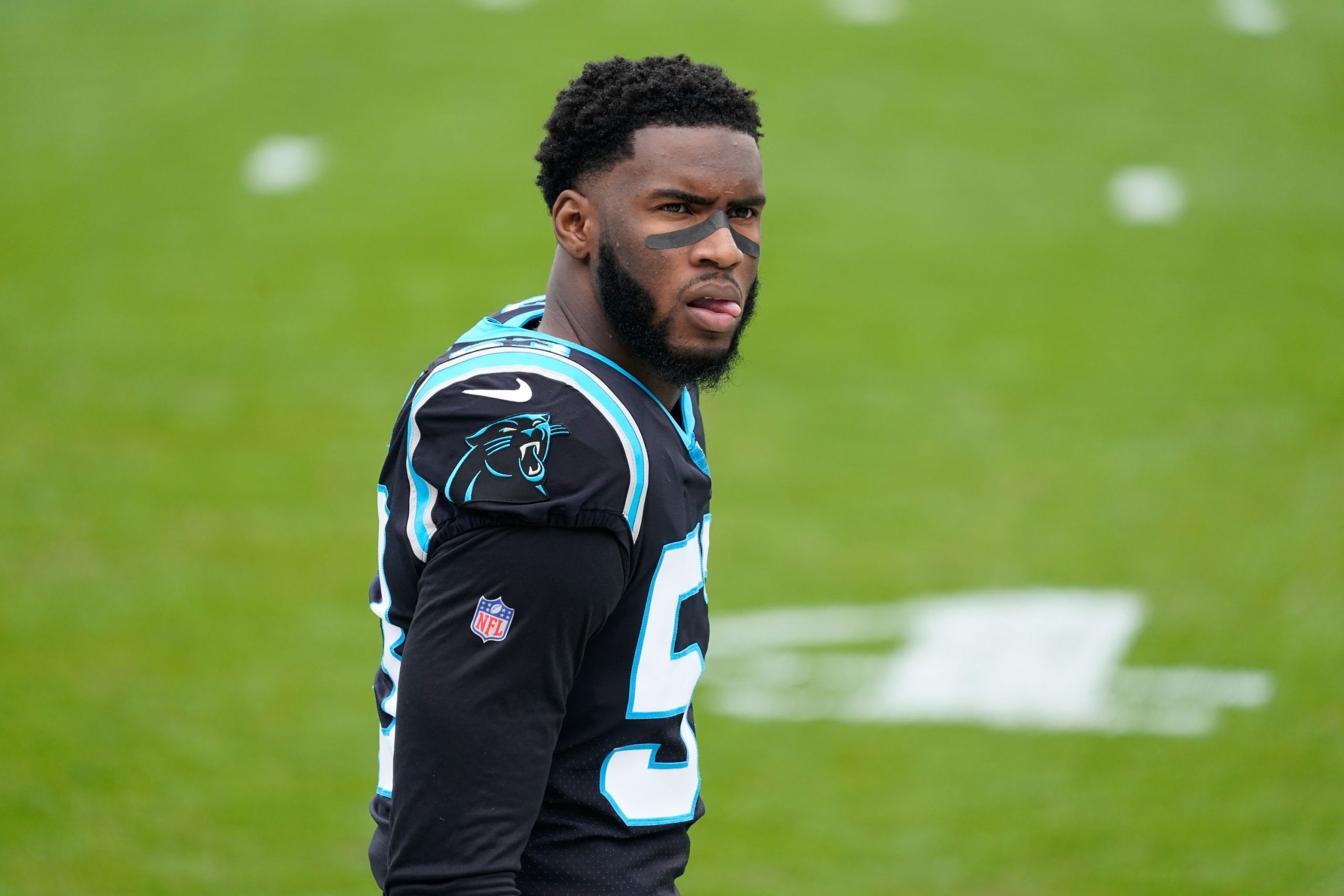 Baltimore Ravens quarterback Lamar Jackson (8) runs the ball and hurdles Carolina  Panthers cornerback CJ Henderson during the first half of an NFL football  game, Sunday, Nov. 20, 2022, in Baltimore. (AP