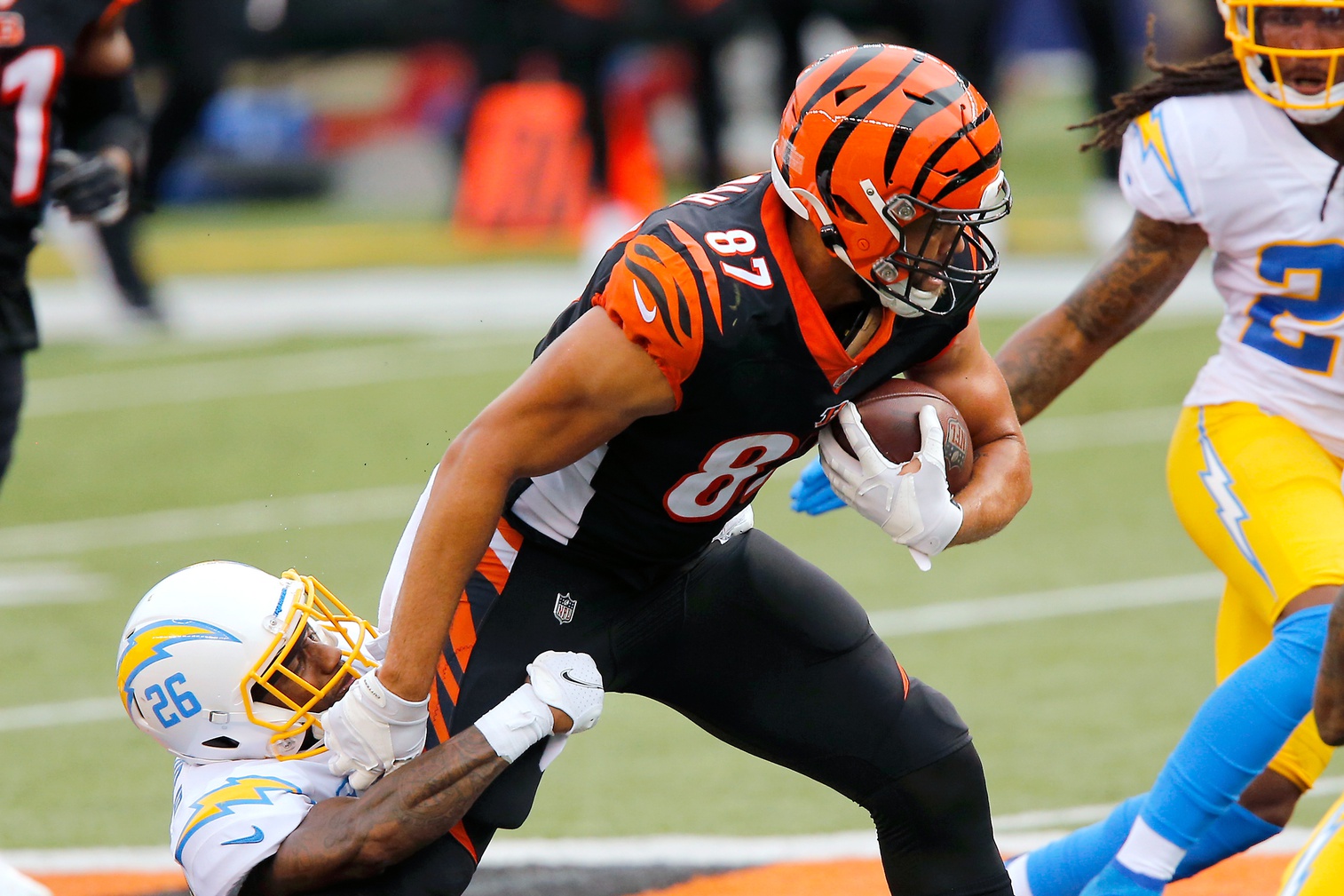 Cincinnati Bengals tight end C.J. Uzomah (87) leaps in the air to