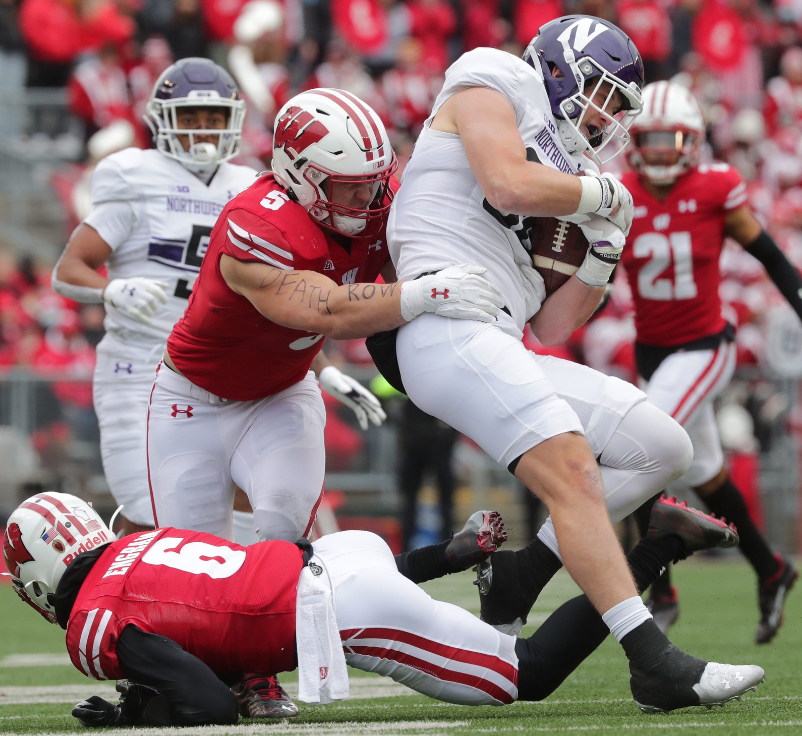 Madison, WI, USA. 13th Nov, 2021. Wisconsin Badgers linebacker Leo Chenal  (5) and linebacker Jack Sanborn (57) watching warm ups before the NCAA  Football game between the Northwestern Wildcats and the Wisconsin