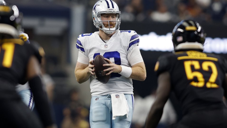 Dallas Cowboys quarterback Cooper Rush (10) hands the ball off during an  NFL football game against the Washington Commanders, Sunday, Oct. 2, 2022,  in Arlington. (AP Photo/Tyler Kaufman Stock Photo - Alamy