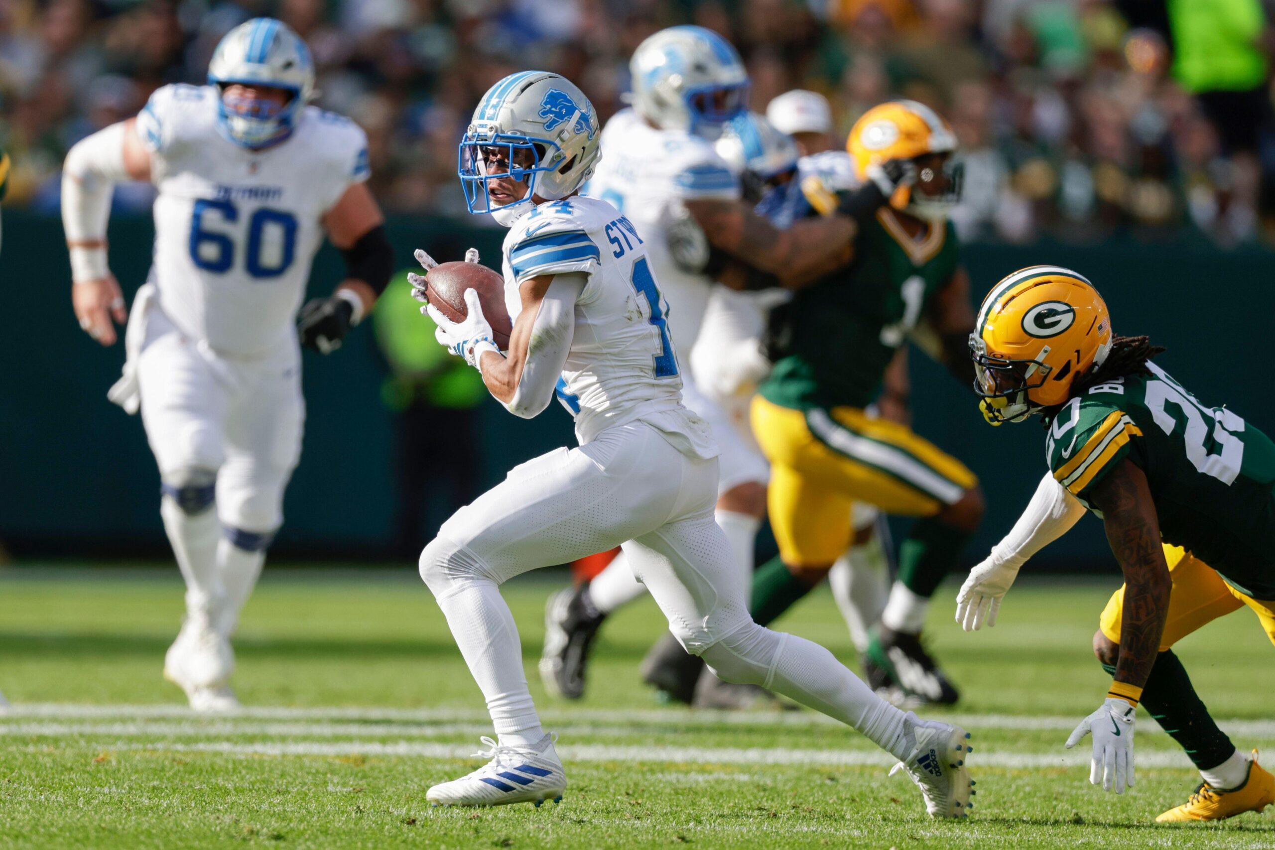 3CJRRFC Detroit Lions wide receiver Amon-Ra St. Brown (14) catches a pass during an NFL football game between the Detroit…